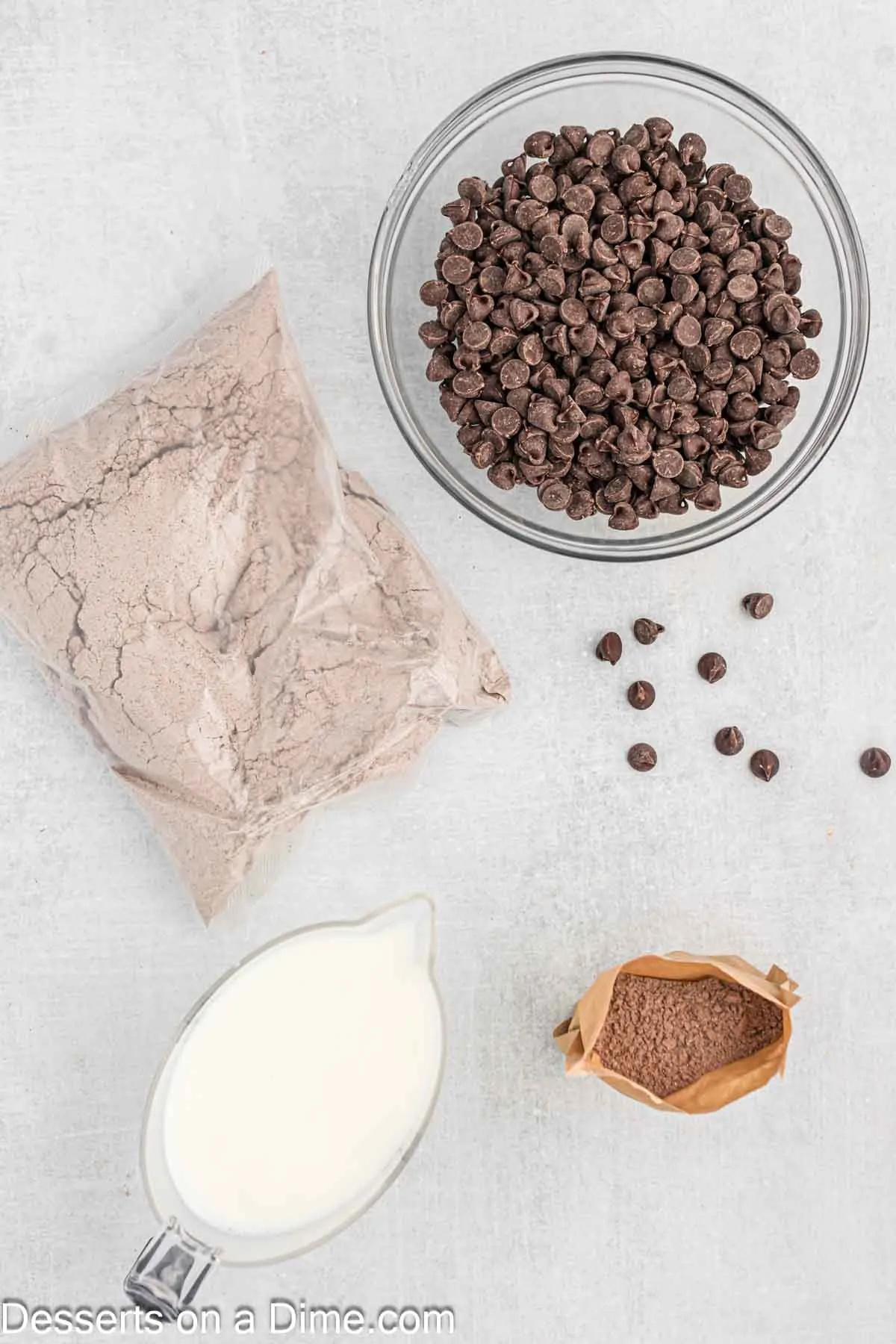 Ingredients for recipe - cake mix, pudding, milk, chocolate chips.