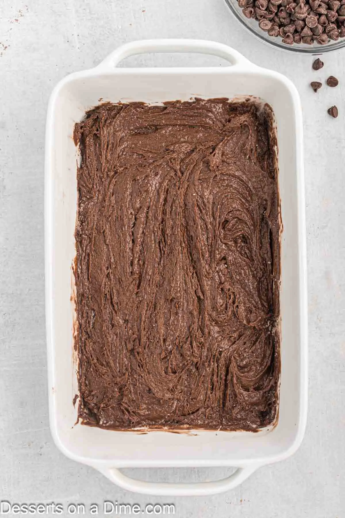 Baking dish with cake mix on top.