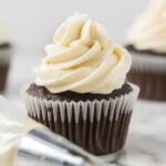 Chocolate cupcake topped with marshmallow frosting.