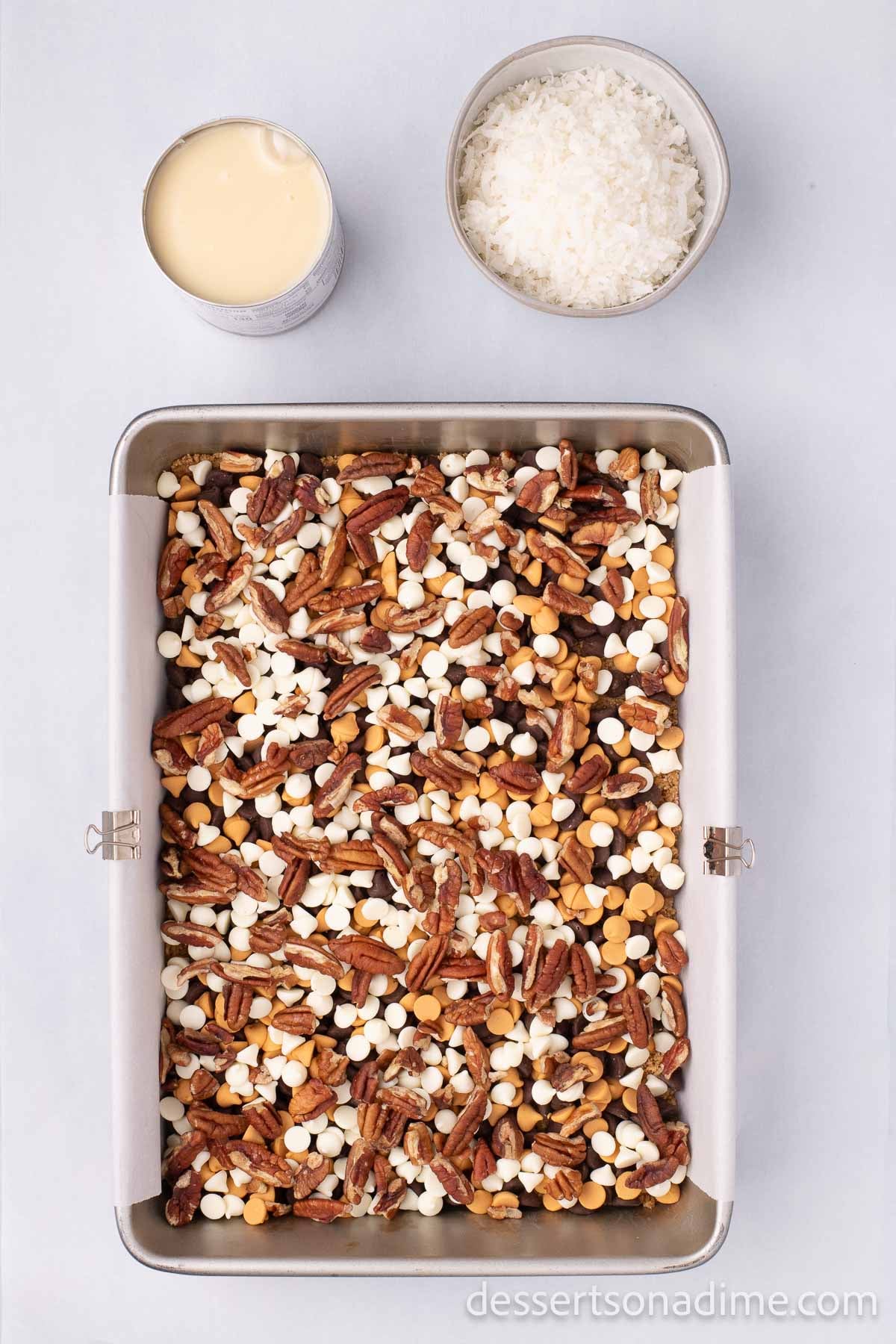 The chopped nuts spread in an even layer on top of the graham cracker crumb crust.  