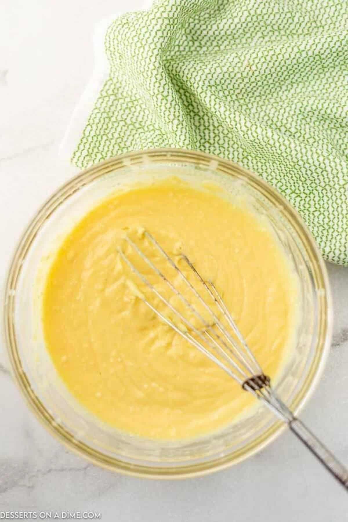 Milk and vanilla pudding combined in a bowl. 
