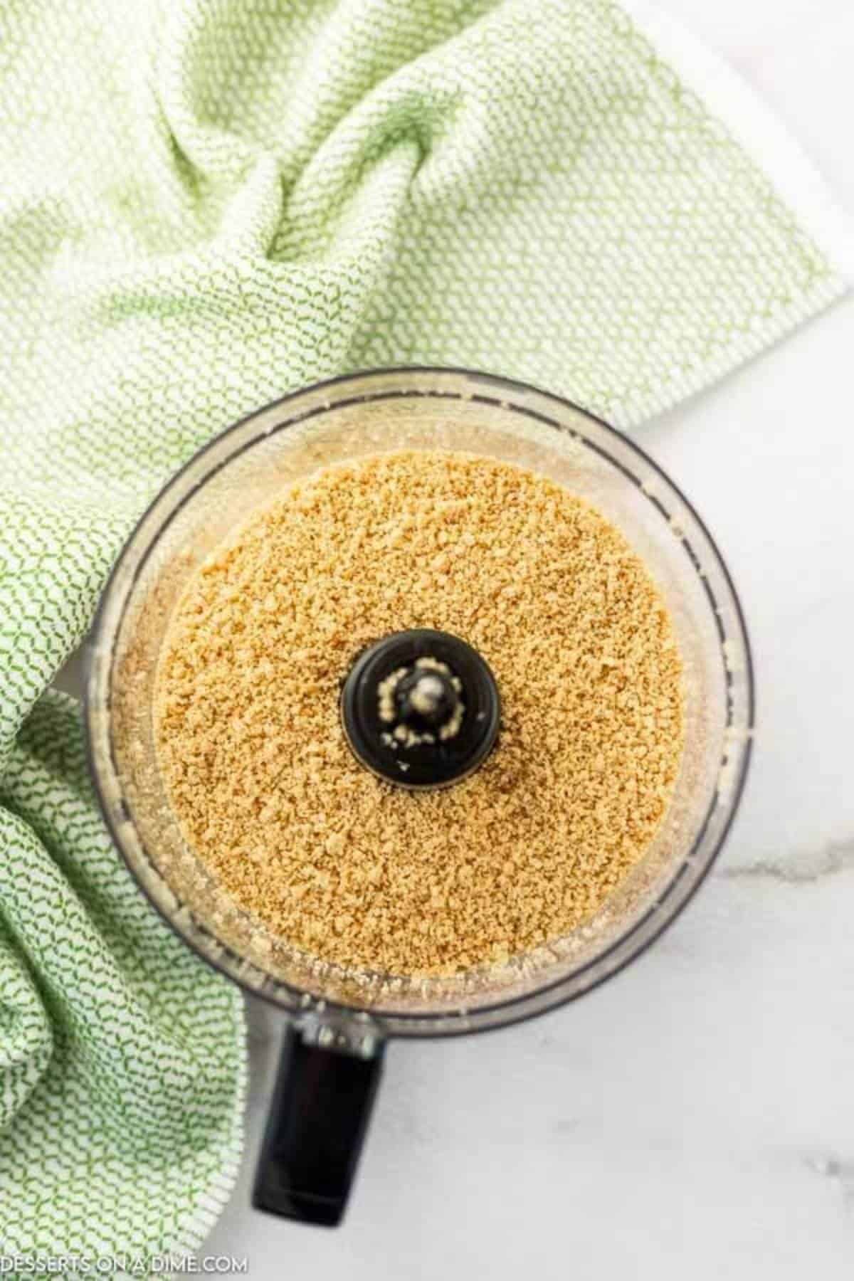 Crushed oreo cookies in a food processor.
