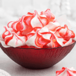 Red bowl with peppermint meringues.