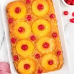 Pineapple upside down cake in a baking dish.
