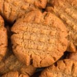 Keto peanut butter cookies stacked together.
