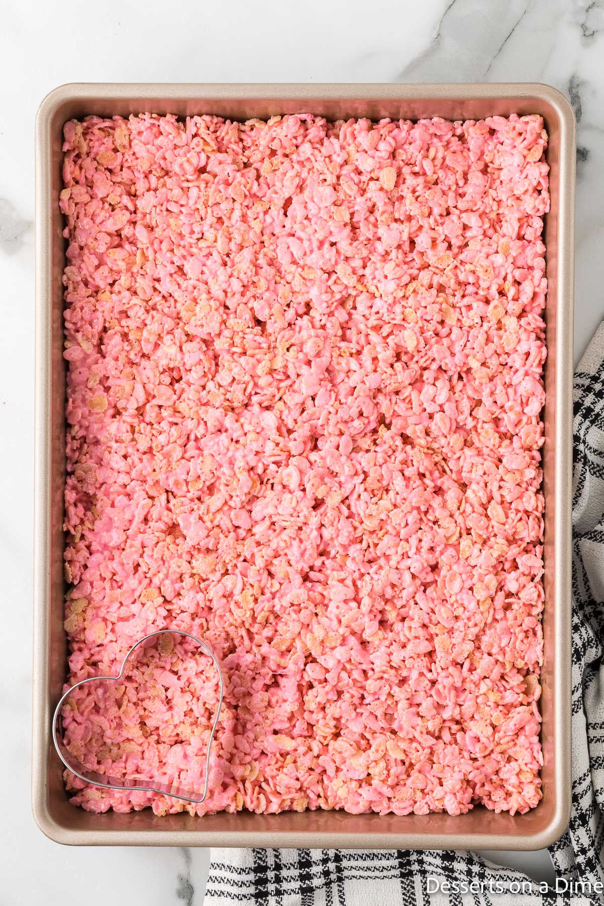 Cereal mixture spread into pan. 