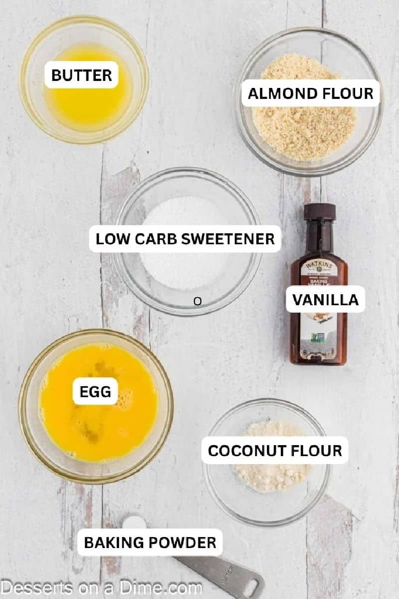 Keto Vanilla Mug Cake is the perfect keto treat to enjoy in 90 seconds. Enjoy this dessert while staying on track with keto for a decadent treat or snack. Ingredients for recipe: butter, almond flour, low carb sweetener, coconut flour and baking; powder.
