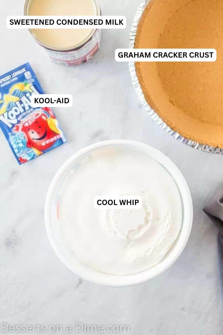 Kool Aid Pie Recipe is a summer time favorite around here. Choose any flavor you like and make this simple and easy 4 ingredient pie recipe. Kool Aid Pie is an easy no bake dessert recipe. Lots of cool whip in this kool aid pie condensed milk recipe come together for a tasty treat. #dessertonadime #koolaidpierecipe Ingredients for recipe: cool whip, kool-aid, graham cracker crust and sweetened condensed milk.