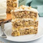 Slice of hummingbird cake on a plate.
