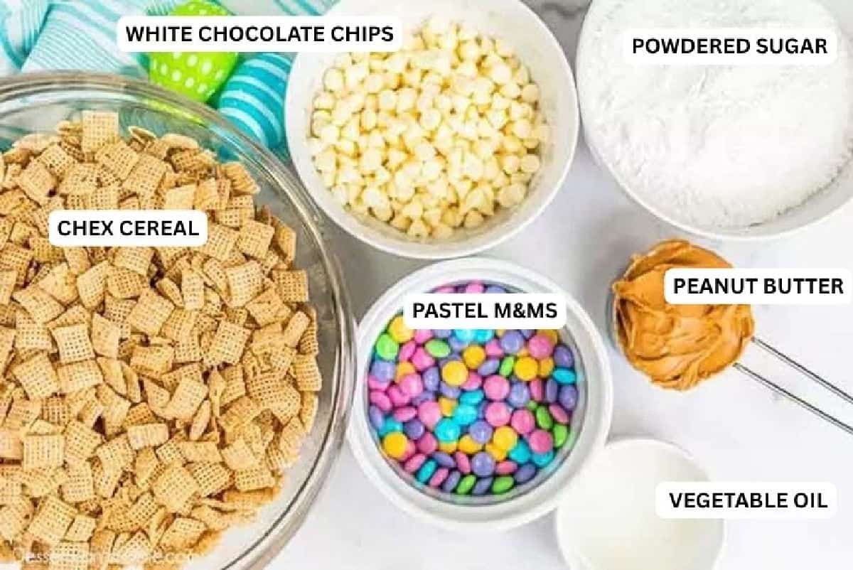 Easter Puppy Chow is fun to make and so delicious. Make this an annual tradition and make Easter muddy buddies for Spring! Ingredients for recipe: white chocolate chips, powdered sugar, chex cereal, M&M's peanut butter and oil.