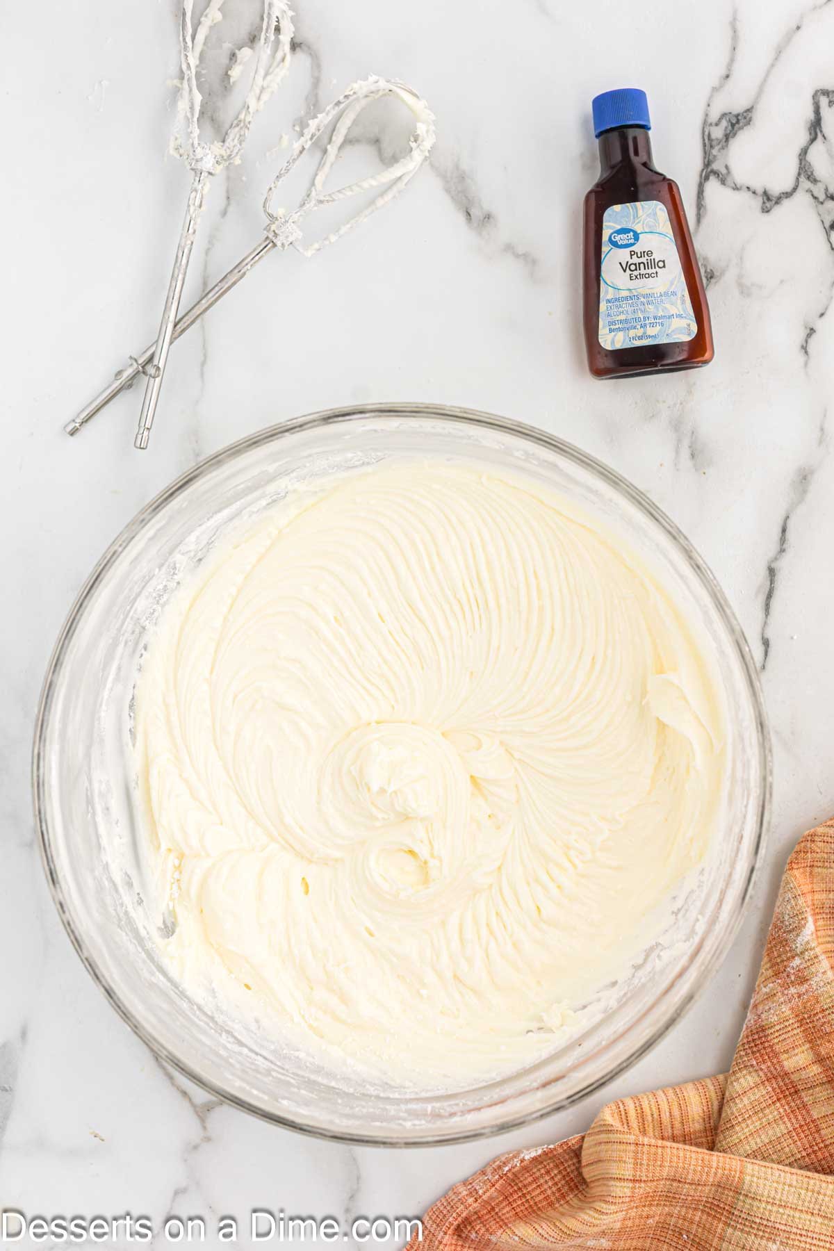 Frosting mixture combined until smooth in mixing bowl.