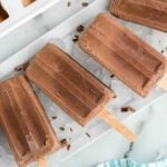 Chocolate popsicles arranged together.