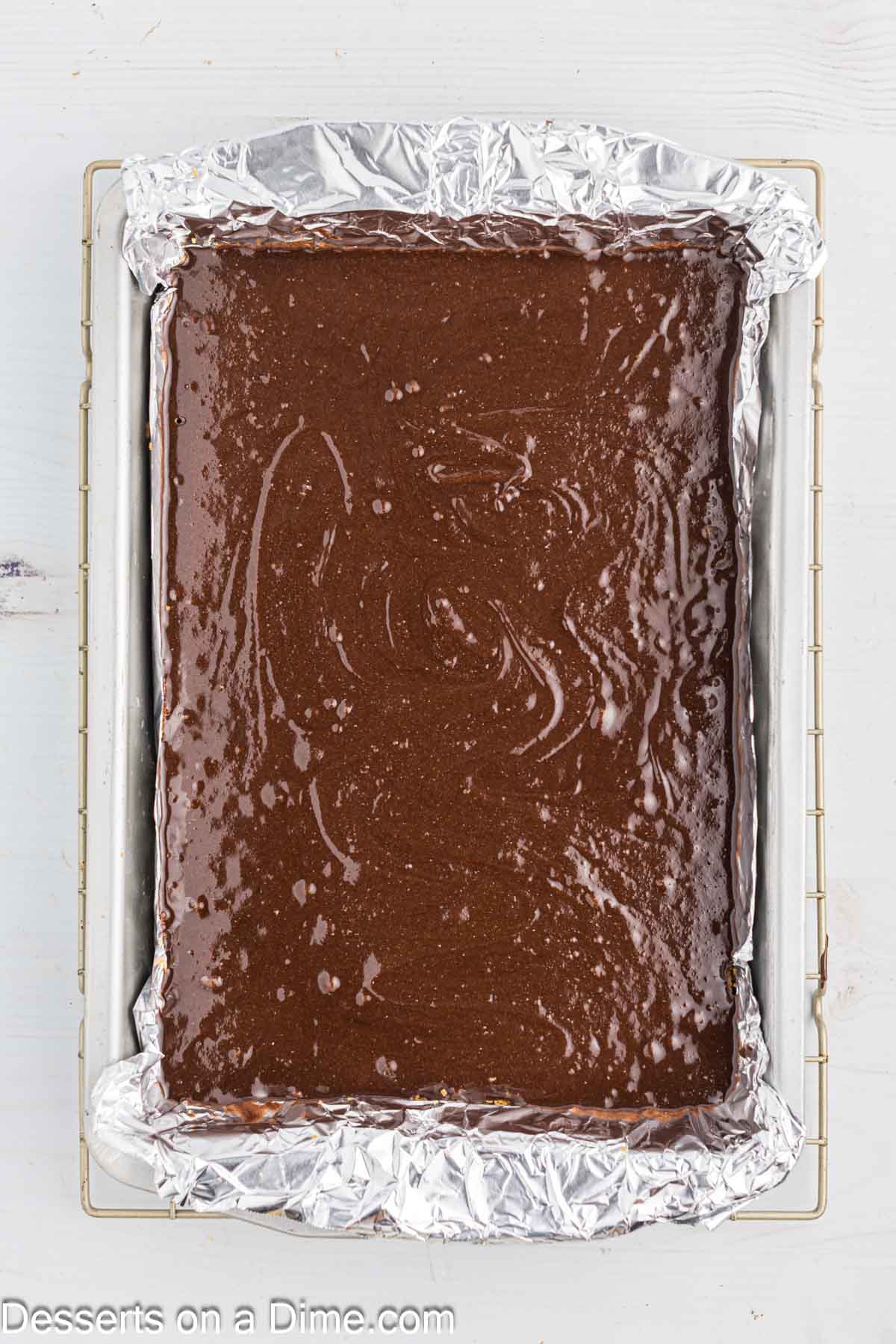 Brownie mix poured over crust.
