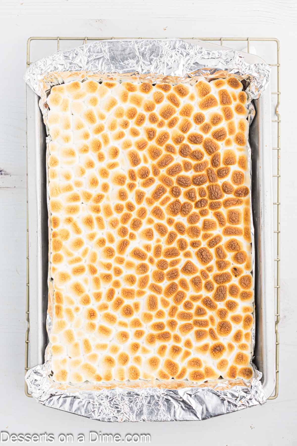 Marshmallows broiled until lightly golden brown.