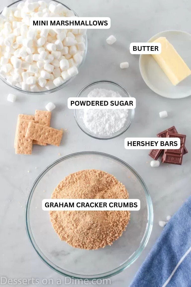 Ingredients for recipe: graham cracker crumbs, butter, mini marshmallows and chocolate bars. 