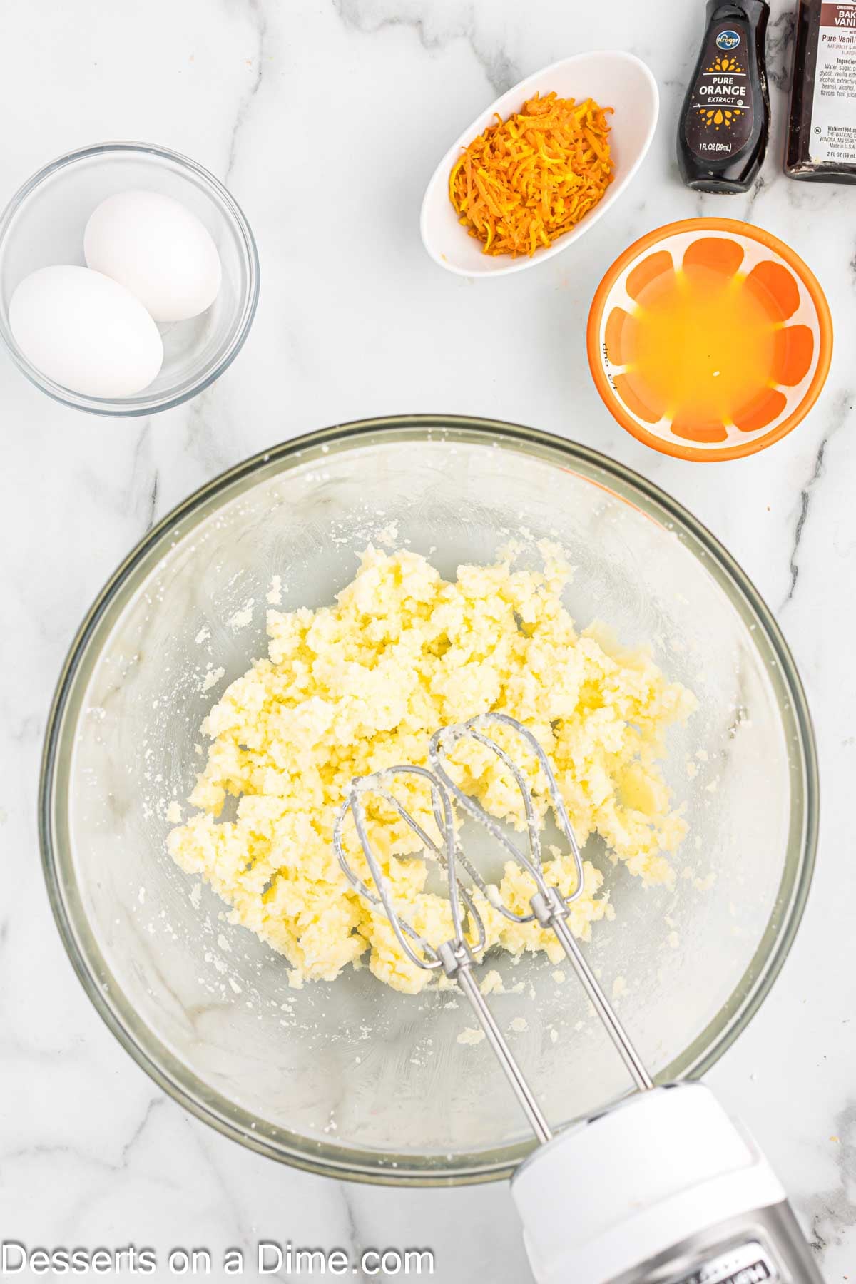 Bowl with butter being beat. 