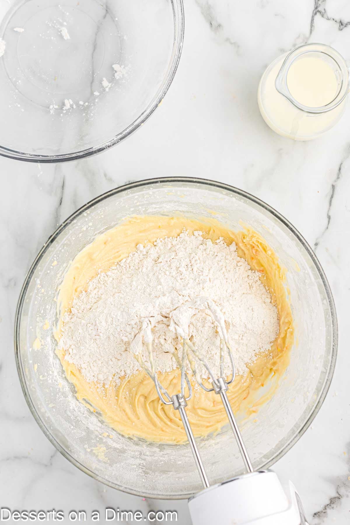 Wet and dry ingredients added to bowl. 