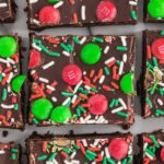 Brownie squares topped with red and green sprinkles.