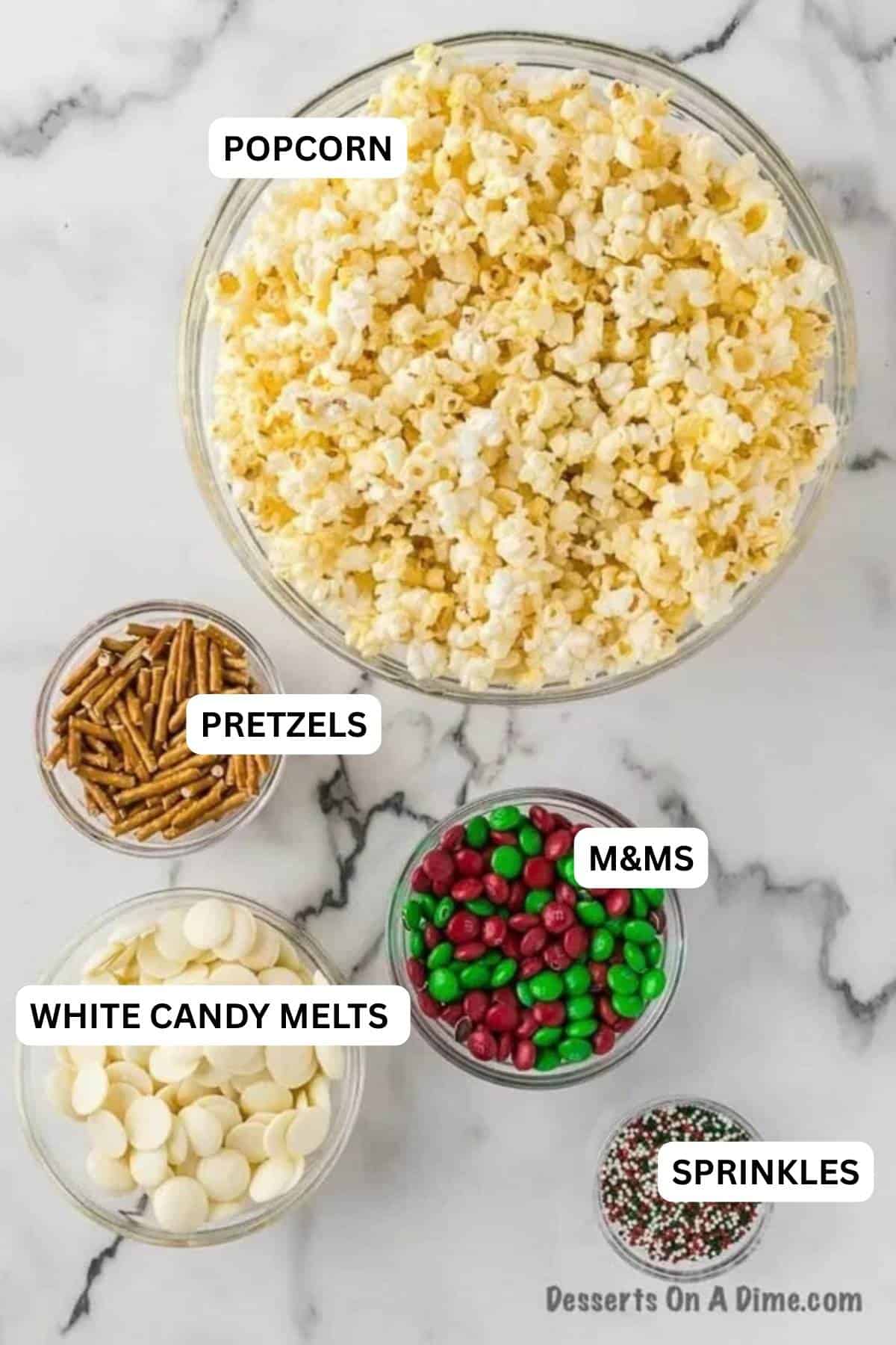 Ingredients for recipe: popcorn, pretzels, white candy melts, M&Ms, and sprinkles.