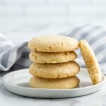 Sugar Cookies stacked together on a plate.