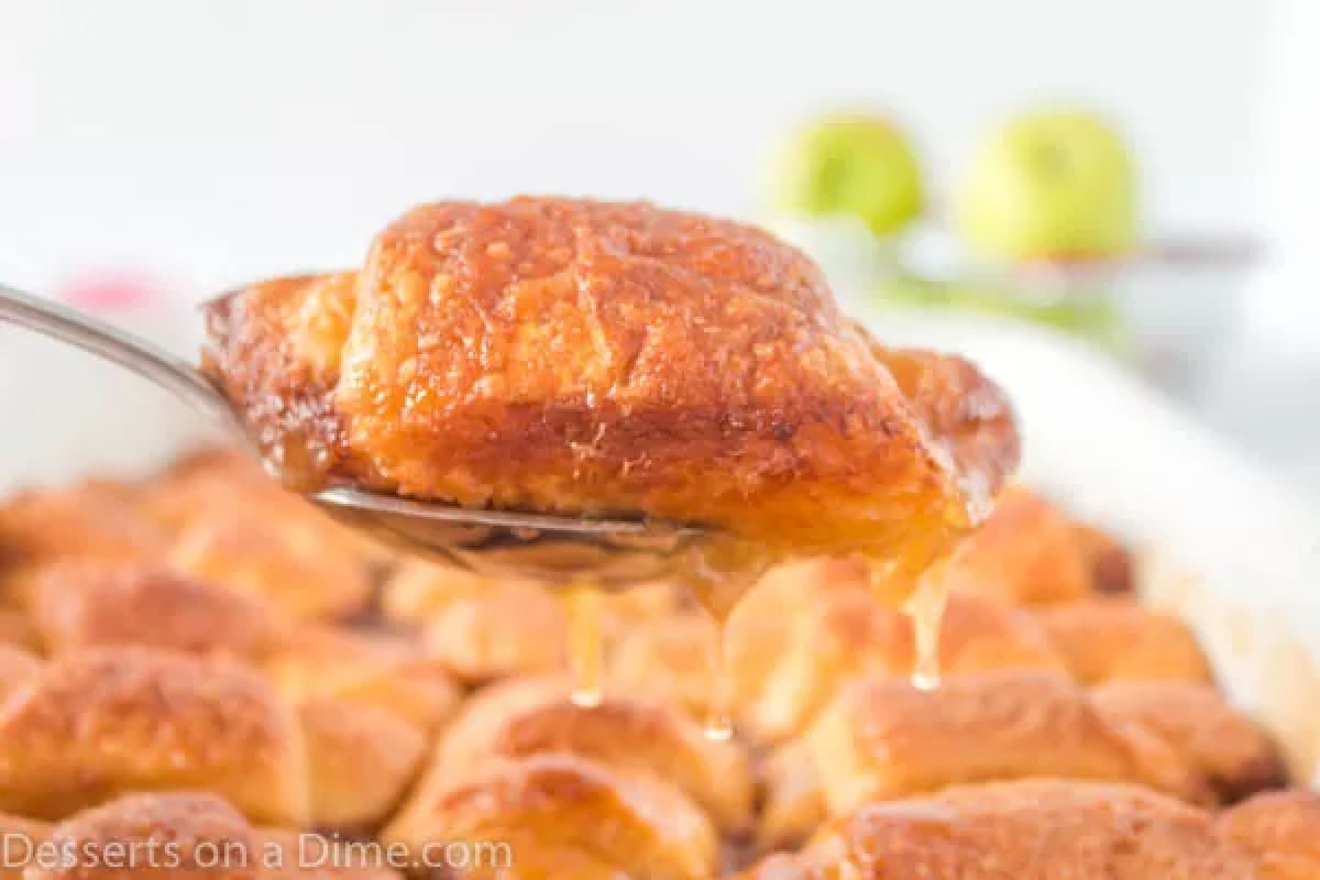 Crescent Roll Apple Dumplings being served on a spoon.