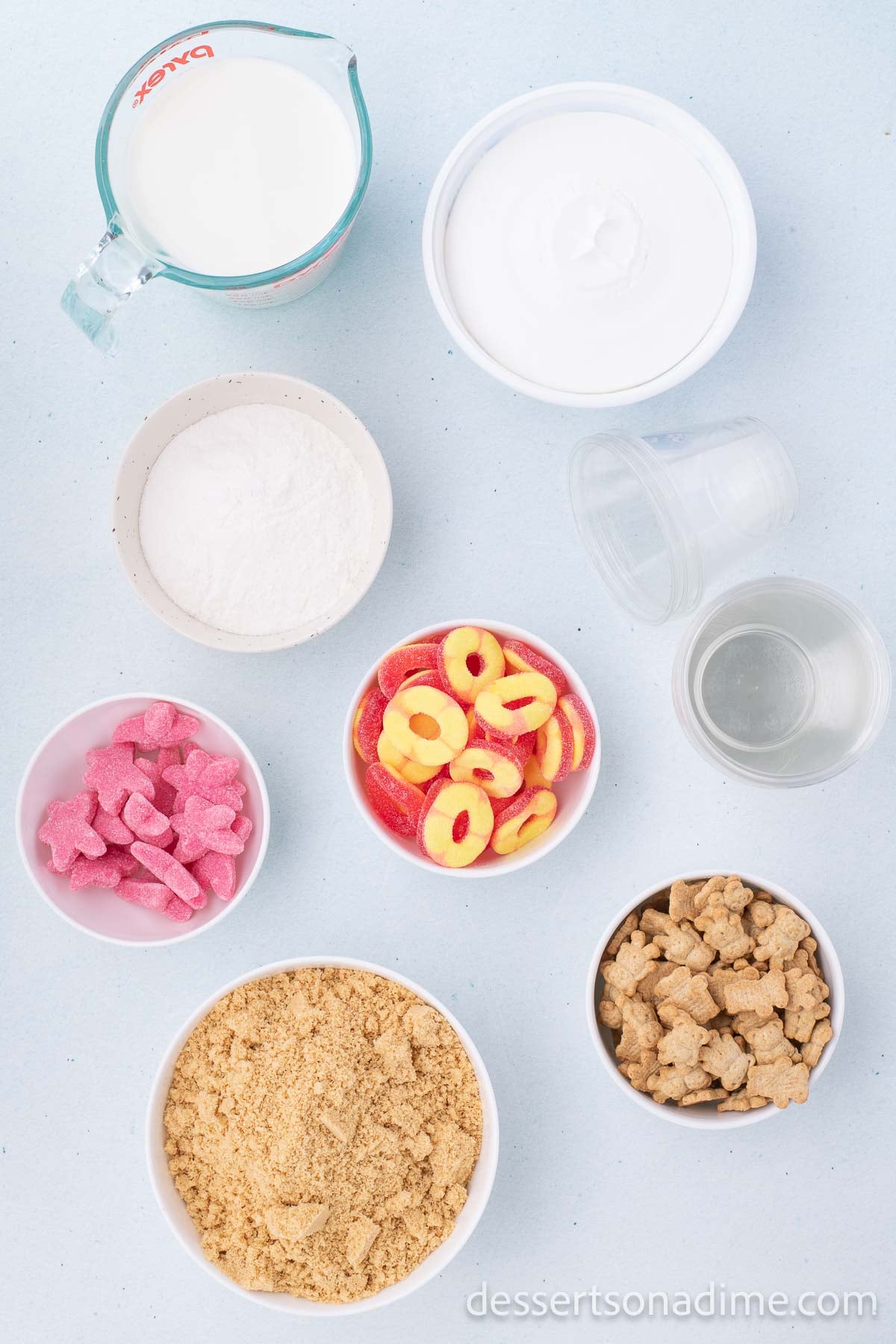 Ingredients for recipe - pudding, whipped topping, oreo cookies, candy.