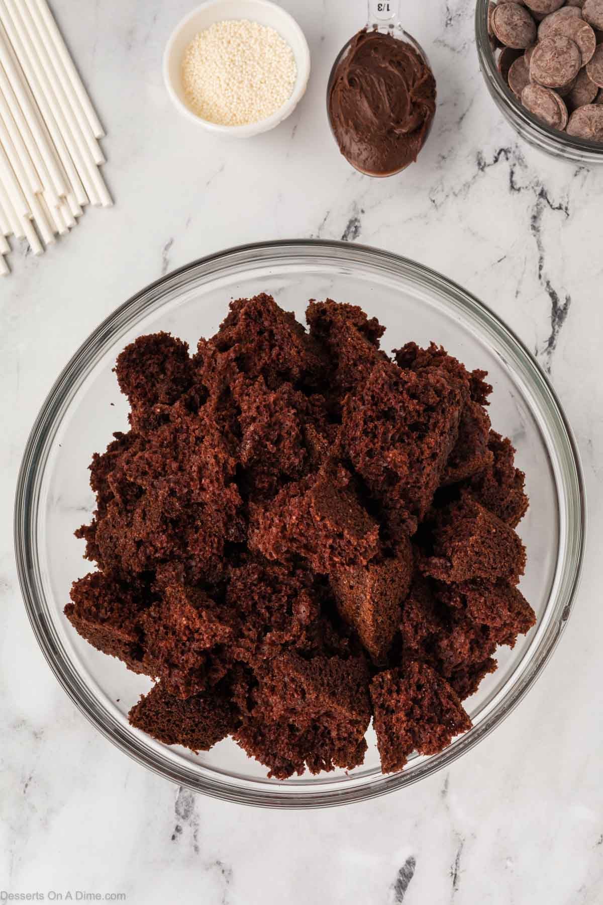 Cake crumbled in bowl. 