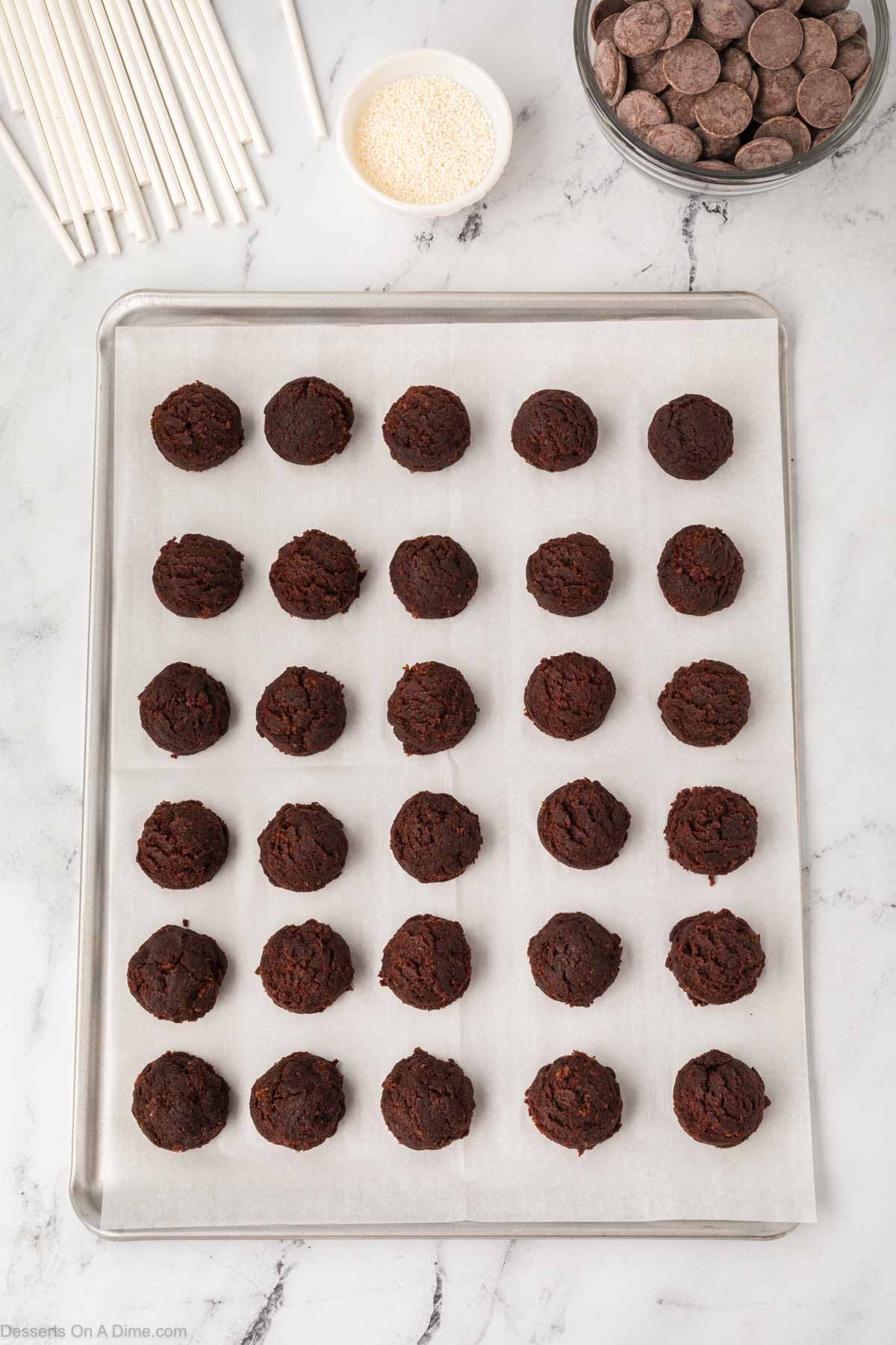 Cake balls on baking sheet.