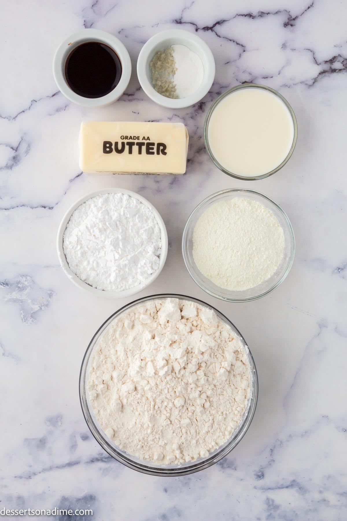 Ingredients for recipe - flour, custard powder, butter, powdered sugar, vanilla, milk. 