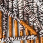 Chocolate Covered Pretzel Rods stacked together.
