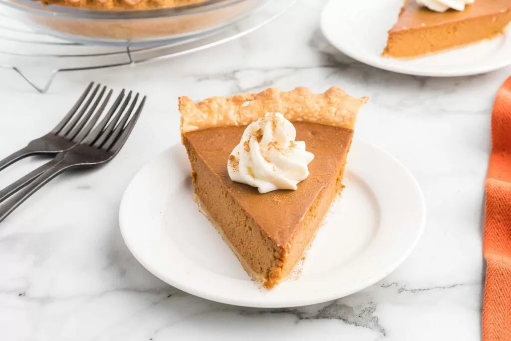 Dulce de leche pumpkin pie on a plate. 
