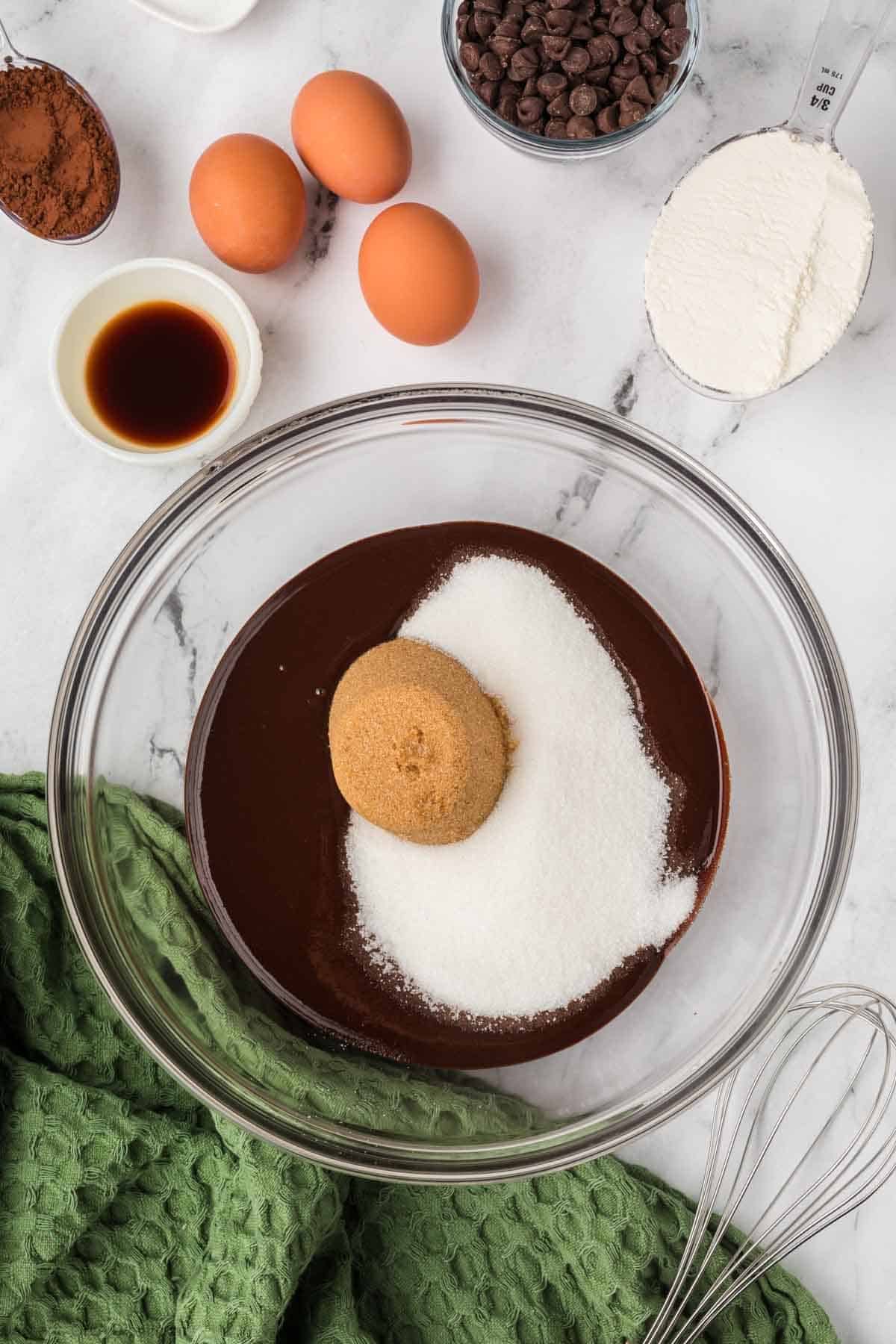 Sugar added to chocolate mixture. 