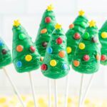 Christmas tree cake pops arranged together.