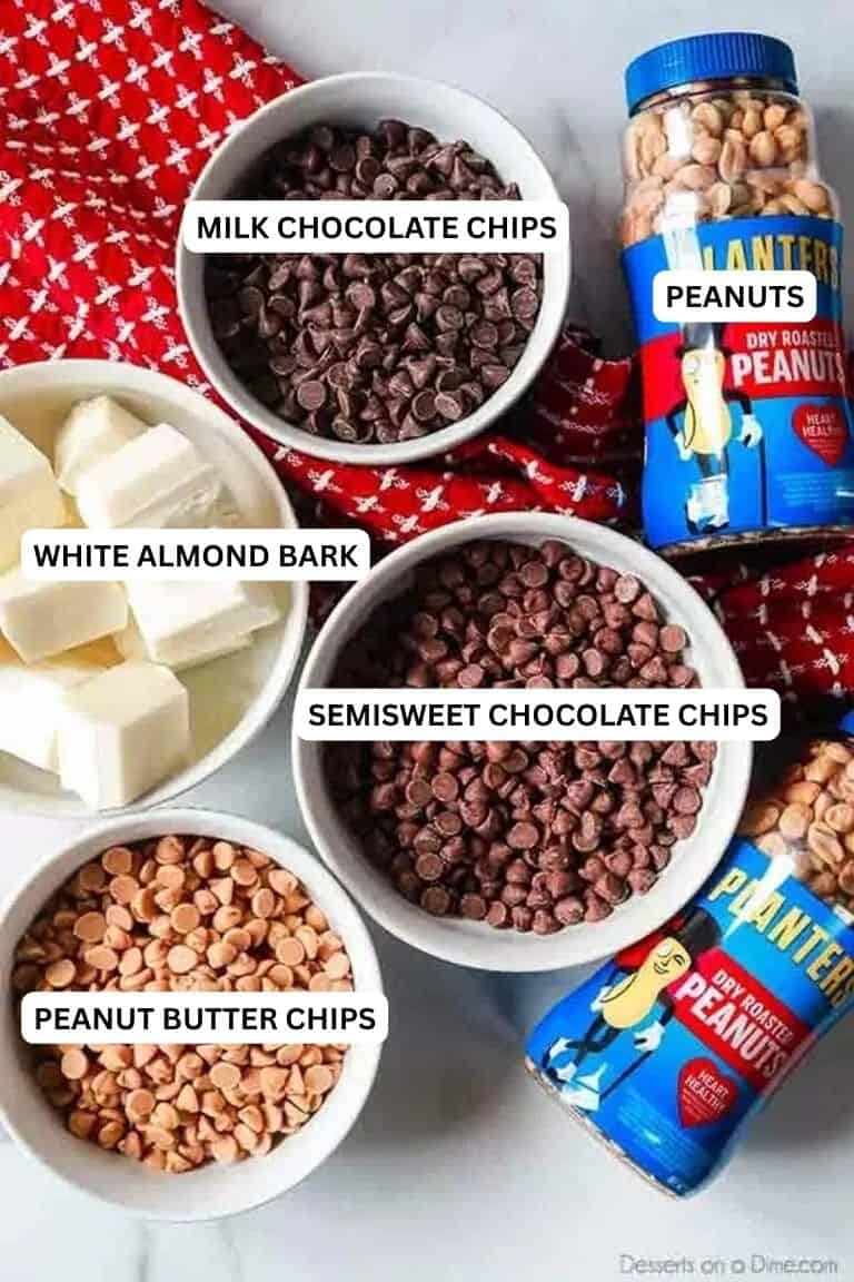 Ingredients for recipe: milk chocolate chips, peanuts, white almond bark, semisweet chocolate chips and peanut butter chips. 