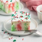 Christmas poke cake cut and served.