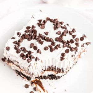Chocolate lasagna cut into a slice and served on a plate.