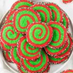 Christmas pinwheel cookies on a platter arranged together.