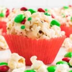 Popcorn ball with Christmas sprinkles and candy.