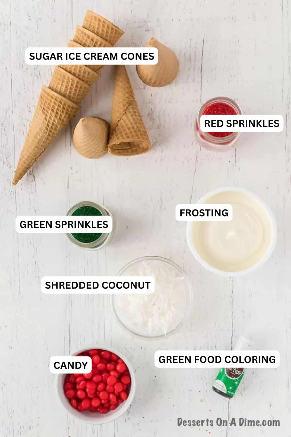 Ingredients for recipe:  sugar ice cream cones, red sprinkles, green sprinkles, frosting, shredded coconut, candy and green food coloring. 