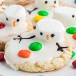 Melted snowman cookies on a platter.