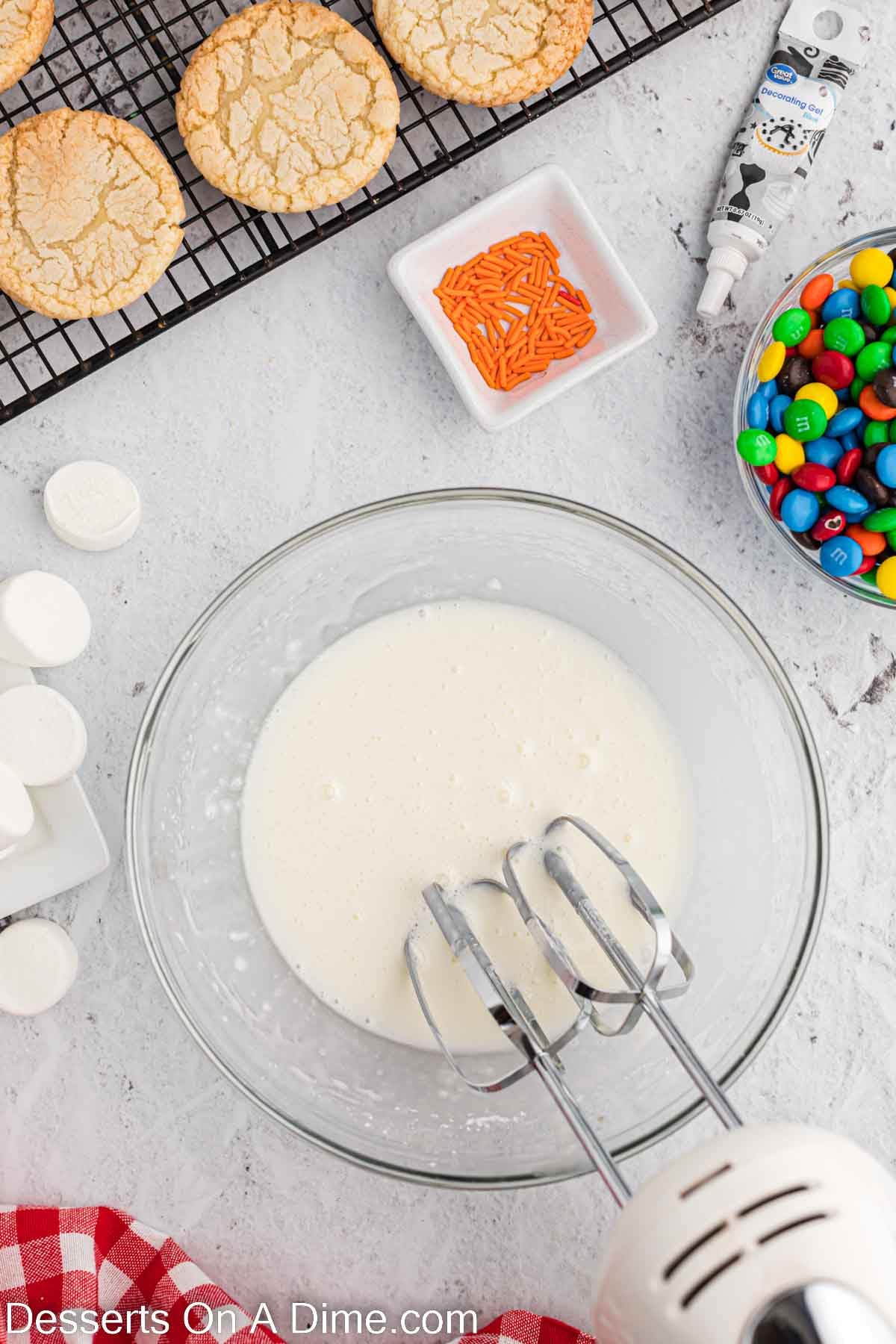 Bowl with icing being combined. 