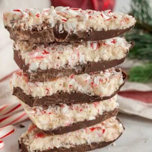 Stack of peppermint bark on a plate.