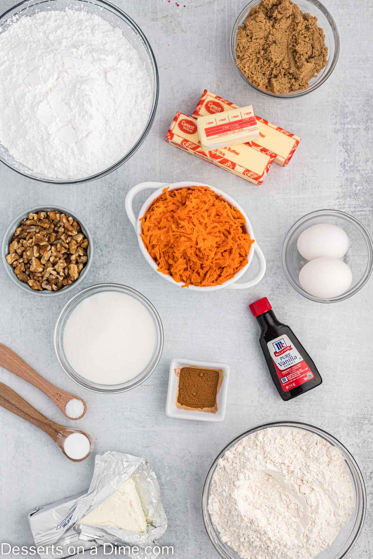 Ingredients for carrot cake cookies - butter, brown sugar, granulated sugar, eggs, vanilla, flour, cinnamon, baking soda, carrots. 
