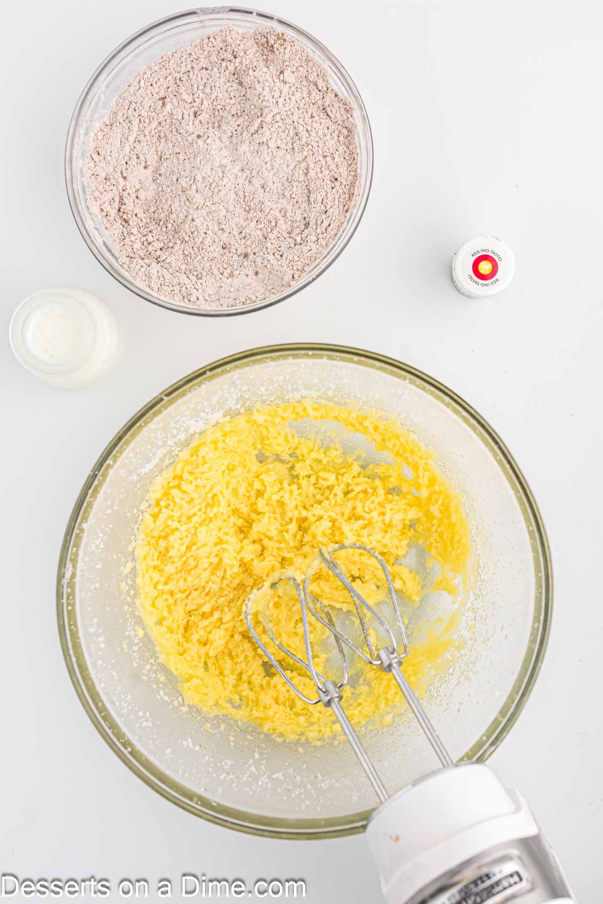 Mixing bowl with butter and sugar combined. 