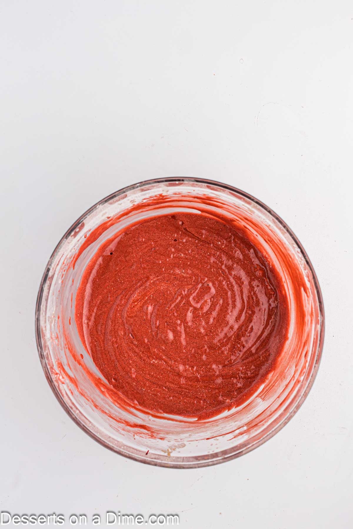 Red food coloring added to bowl. 