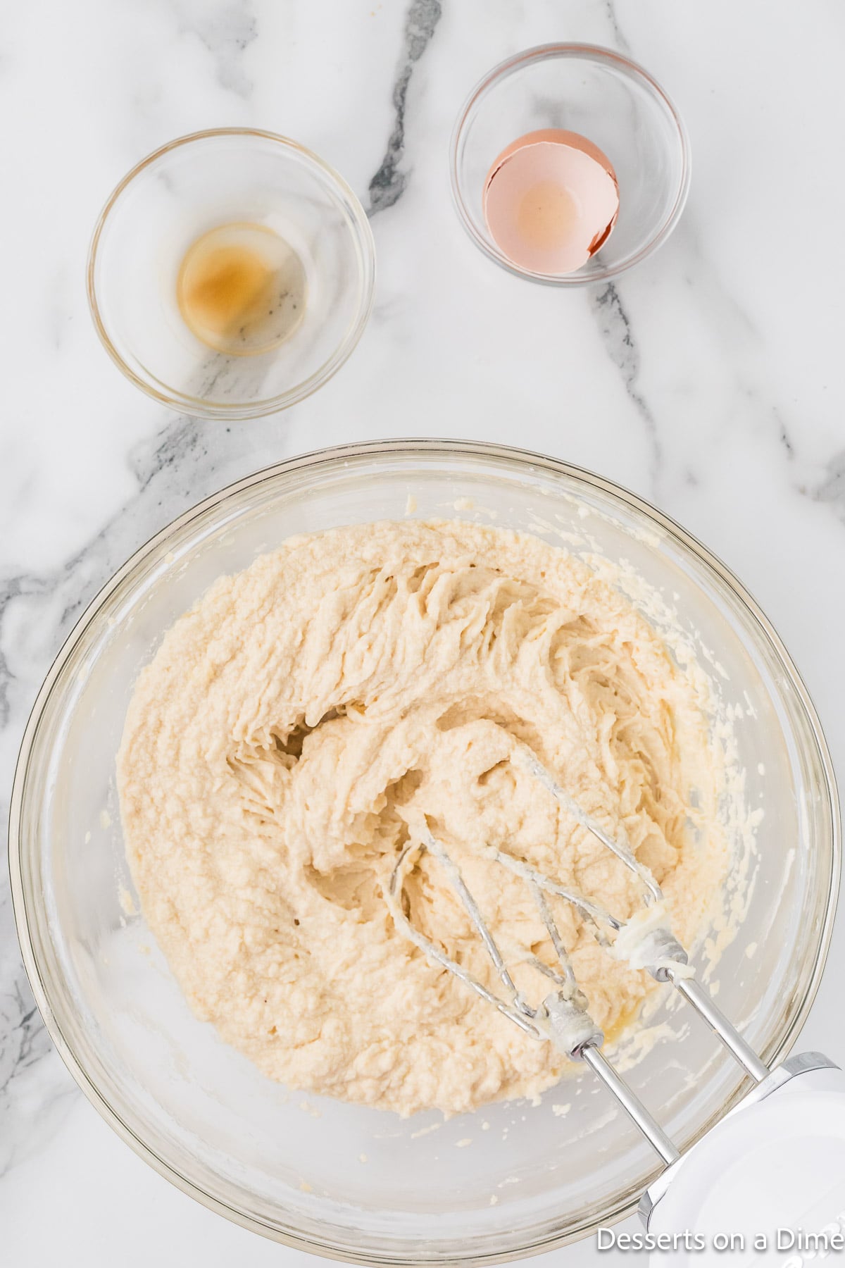 Mixing bowl with butter combined with sugar. 