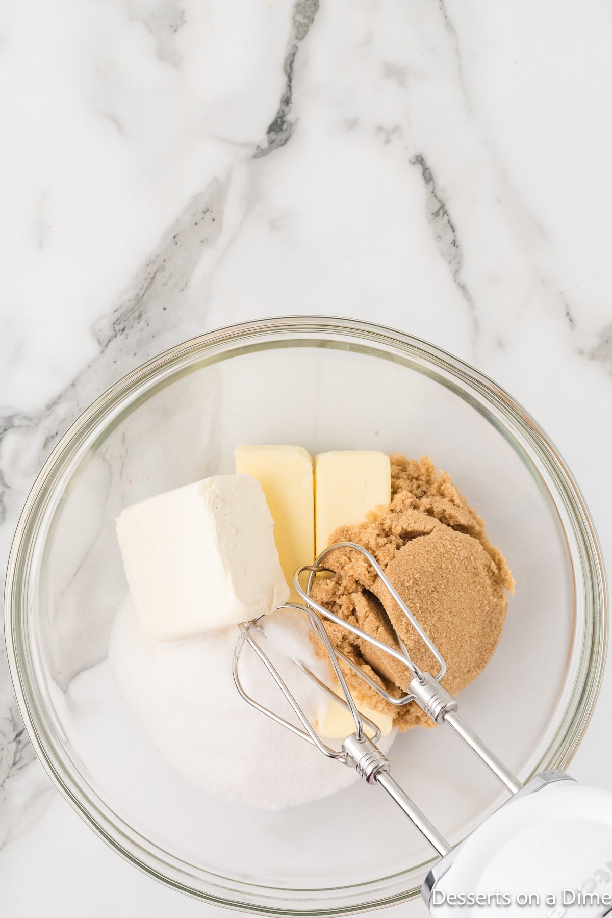 Mixing bowl with butter, cream cheese and sugar.