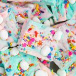 A pile of colorful fudge with sprinkles and marshmallows.