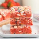Strawberry Cake Mix Brownies stacked together.