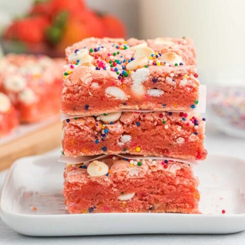 Strawberry Cake Mix Brownies stacked together.